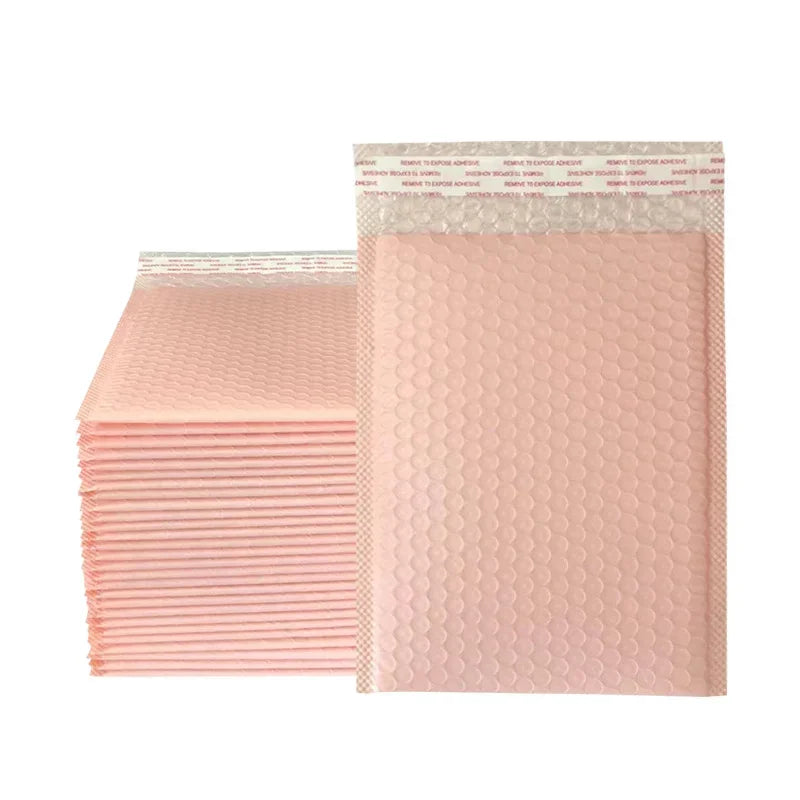 A stack of pink bubble mailers, self-sealing padded envelopes, is shown in a vertical layout.