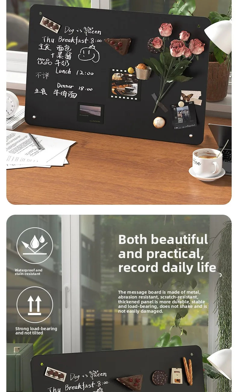 A black magnetic planning board displays a menu, schedule, and various notes on a wooden table.