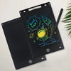 A black portable LCD drawing tablet showing a cartoon rocket and the text Good Luck!