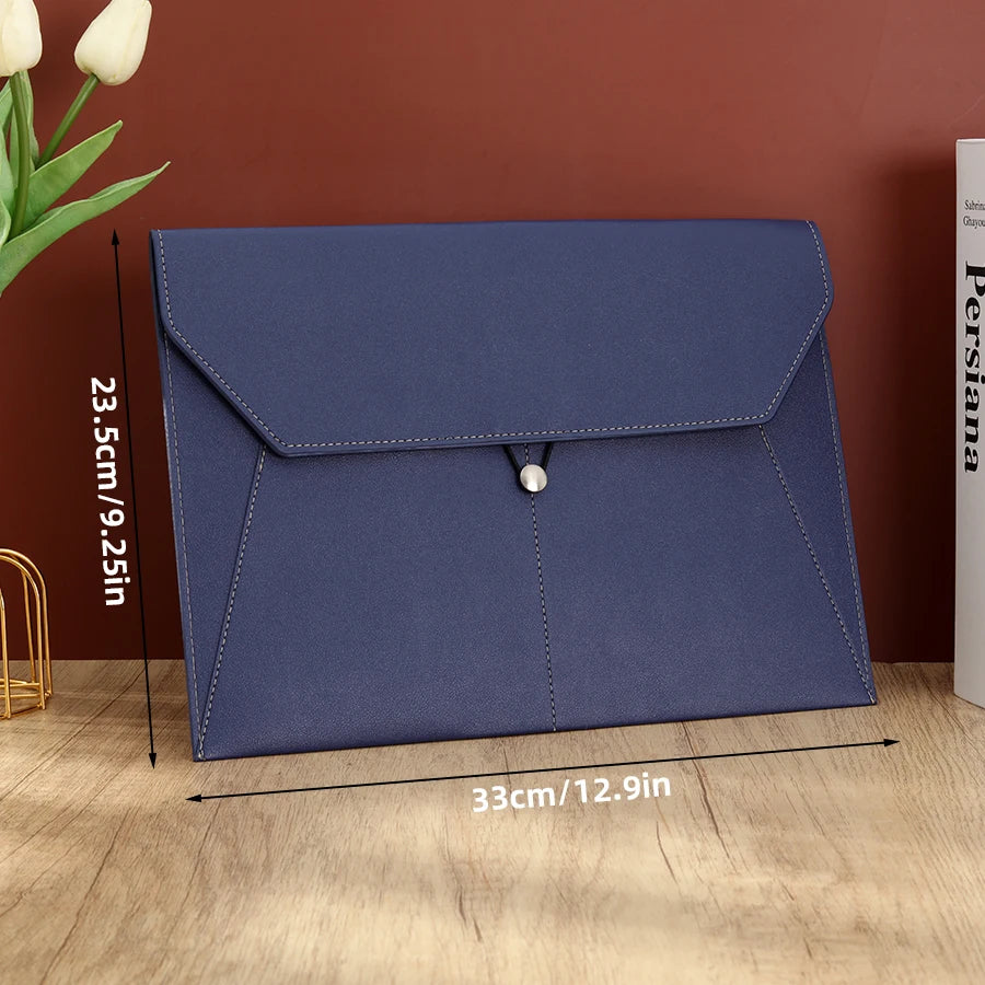 A navy blue leather document organizer bag with a flap closure shown on a wooden surface.