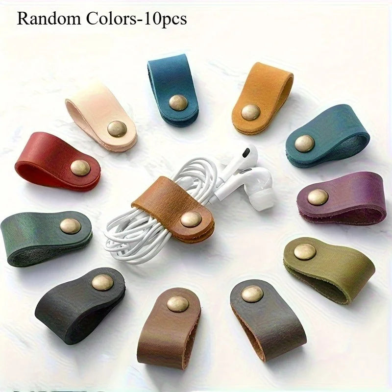 A collection of ten random colored faux leather data cable earphones are displayed on a white background.