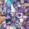 A close-up of purple magic witch stickers featuring mystical elements like crystals, moons, and magical figures.