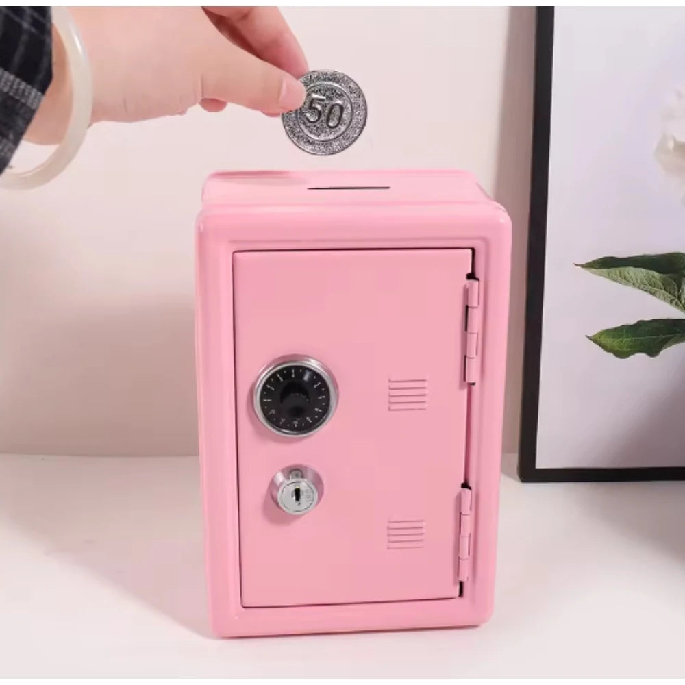 A pink compact home safe box with a combo lock is shown, and a hand is placing a coin on the top.