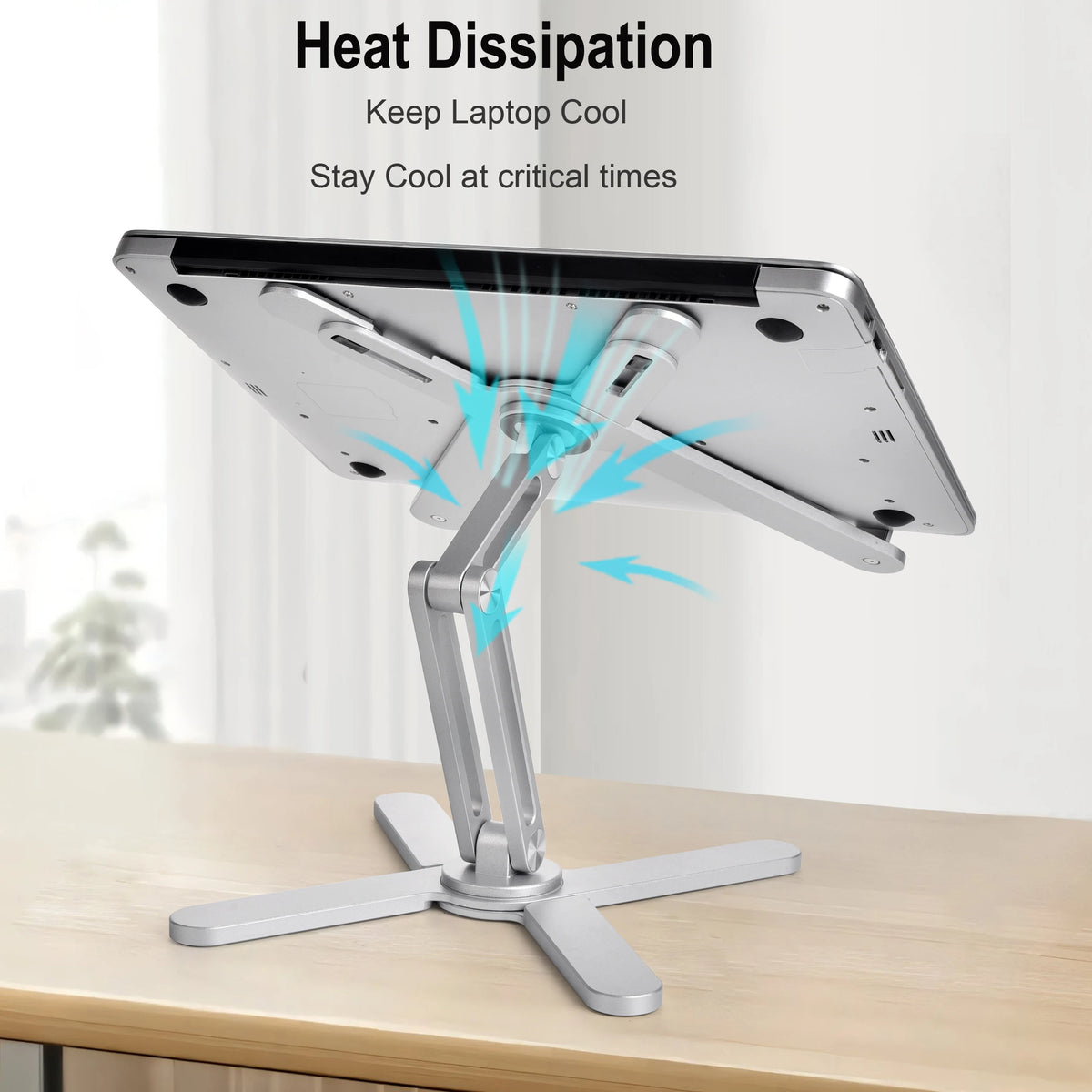 A silver laptop stand is shown supporting a tablet, designed for heat dissipation and keeping the device cool.