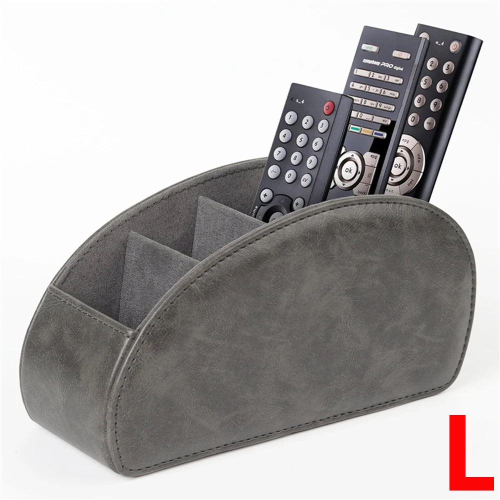 A grey PU leather remote control holder with five compartments displaying various electronic devices.