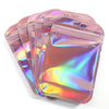 A stack of iridescent pink self-sealing jewelry pouches with resealable zip locks.