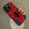 A phone case featuring a red background with a black spider web design and a black spider silhouette.