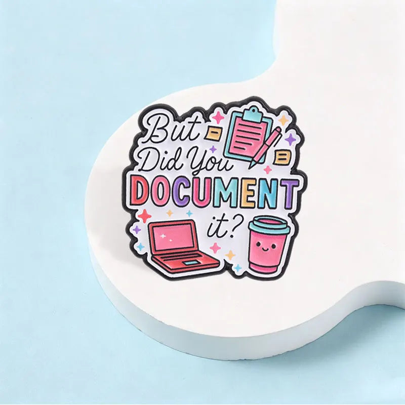 An enamel pin featuring the text But Did You Document It? with icons of a laptop and a document.