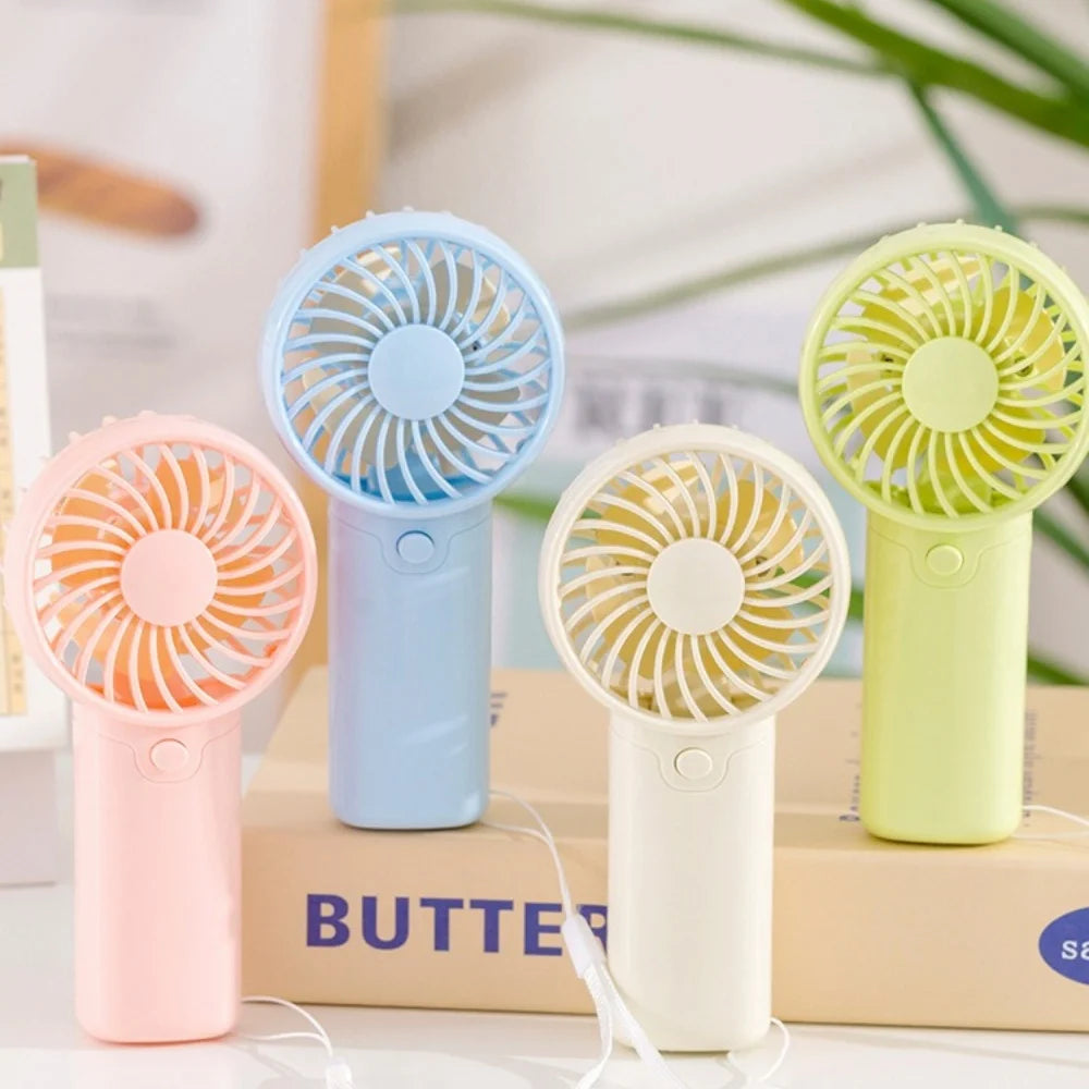 A collection of portable rechargeable mini handheld fans in pink, blue, white, and lime green colors.