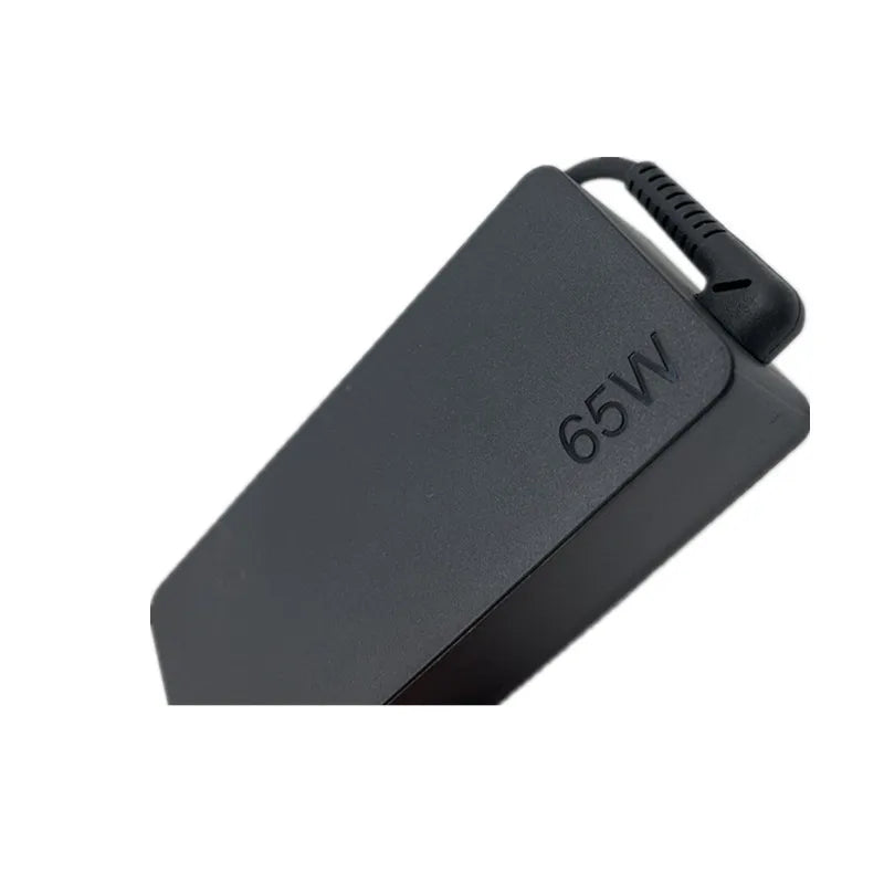 Black universal 65W USB-C AC adapter for laptops.