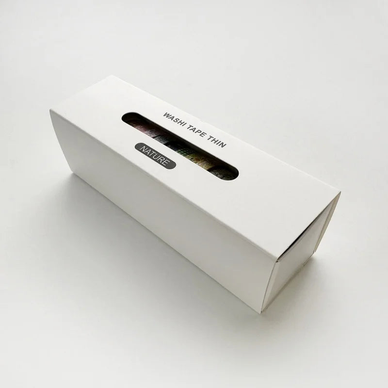 A white box of Washi Tape Thin with a natural theme is shown on a light surface.