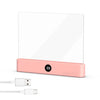 A pink acrylic book night light with a digital timer display and a USB charging port.