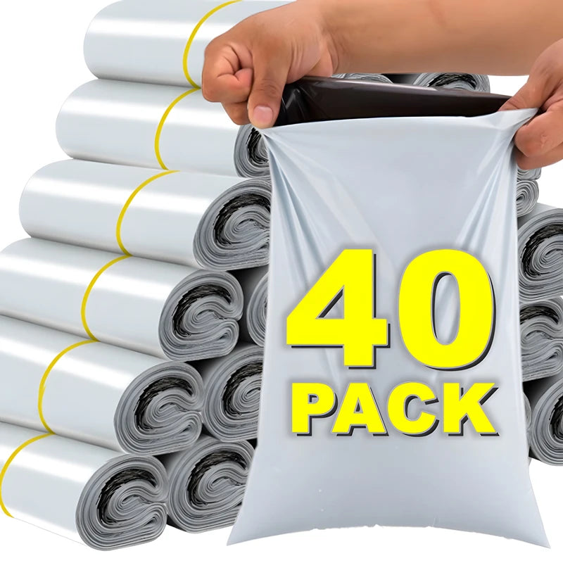 A hand is holding a white self-seal poly mailer bag with the text 40 PACK, next to a stack of rolled white mailers.