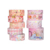 A set of five pink and gold metallic glitter washi tapes stacked vertically for crafting