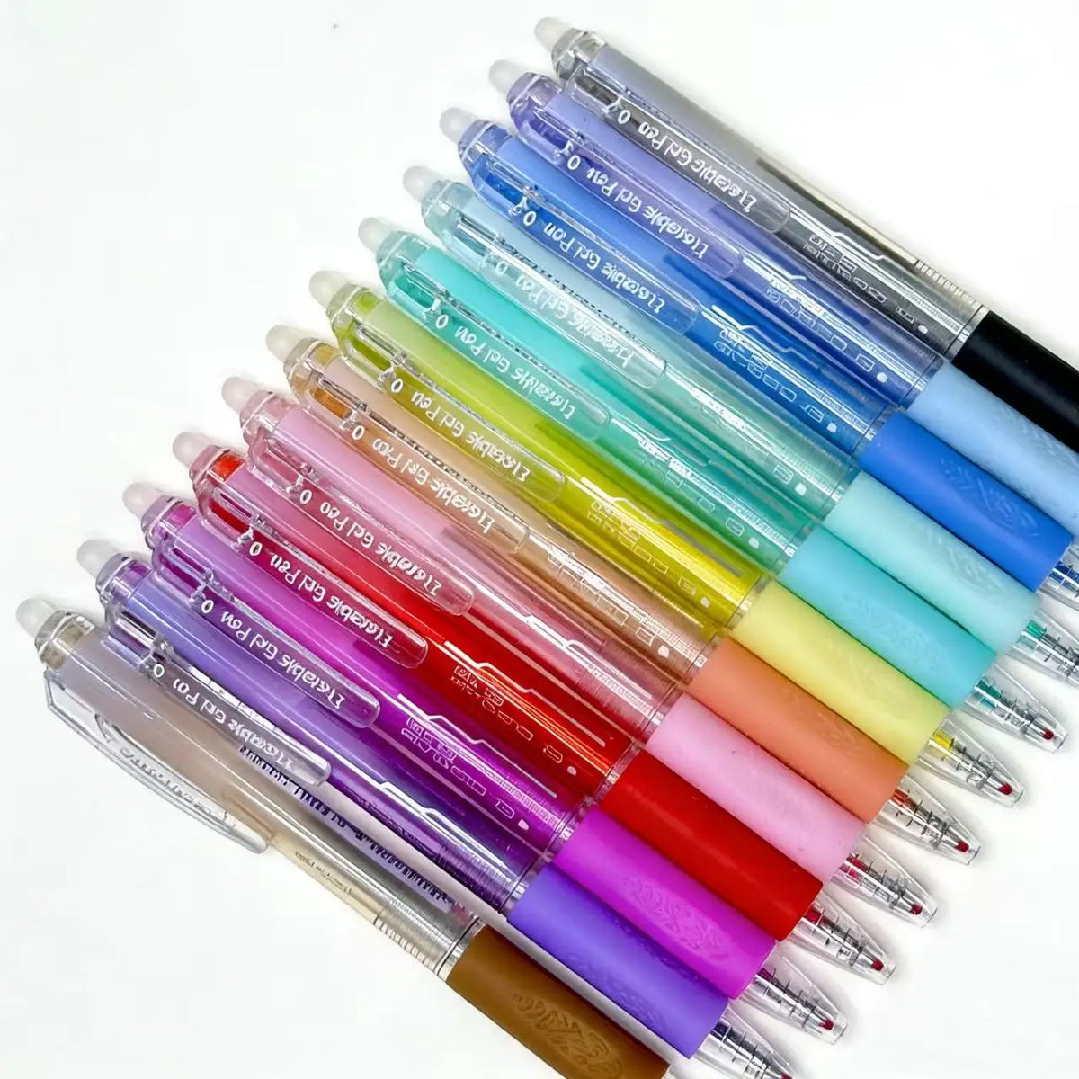 A collection of assorted colored retractable erasable gel pens arranged diagonally.