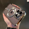 A hand holds a clear magnetic case with a plated finish for a MagSafe iPhone.