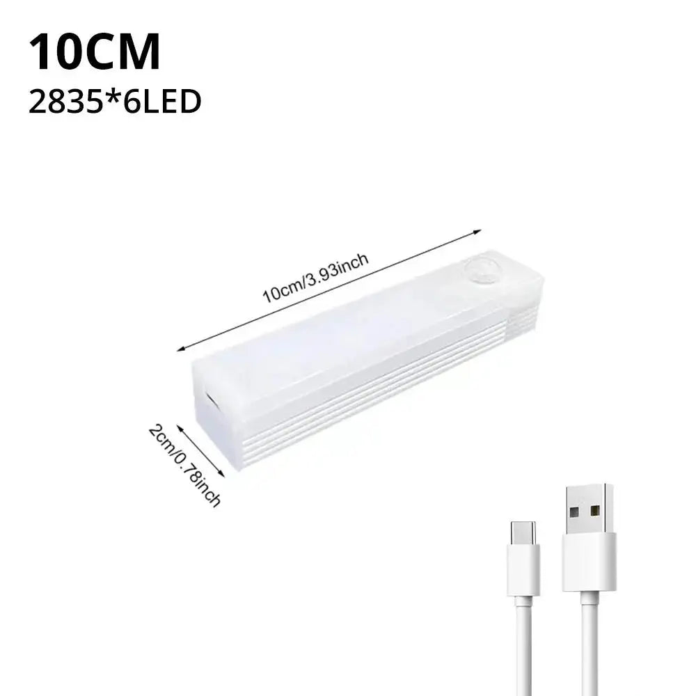 A white motion sensor LED night light with a rectangular body and a connector cable.