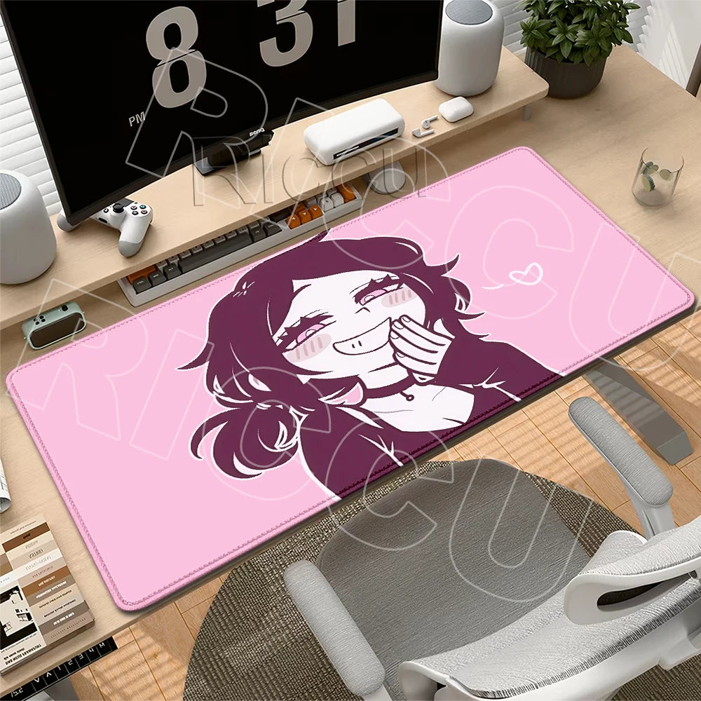 A pink gaming mouse pad featuring a stylized illustration of a smiling woman with purple hair.