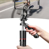 A hand holds a black selfie stick tripod with a smartphone mounted, used for steady shooting.