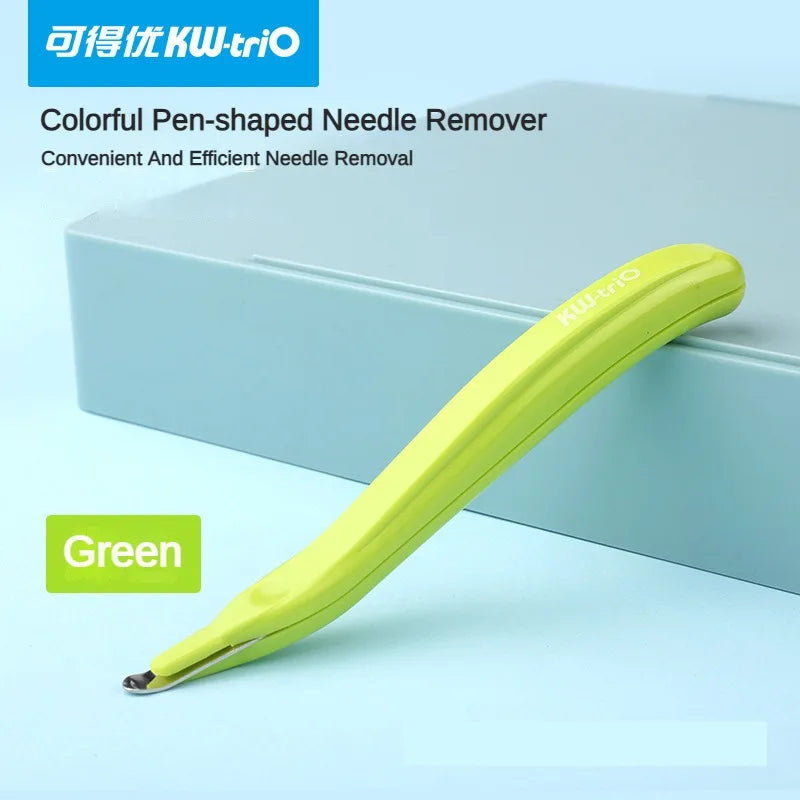 A bright green pen-shaped needle remover tool is shown resting on a light blue box.
