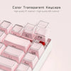 A close-up view of a set of translucent pink jelly keycaps for mechanical keyboards.