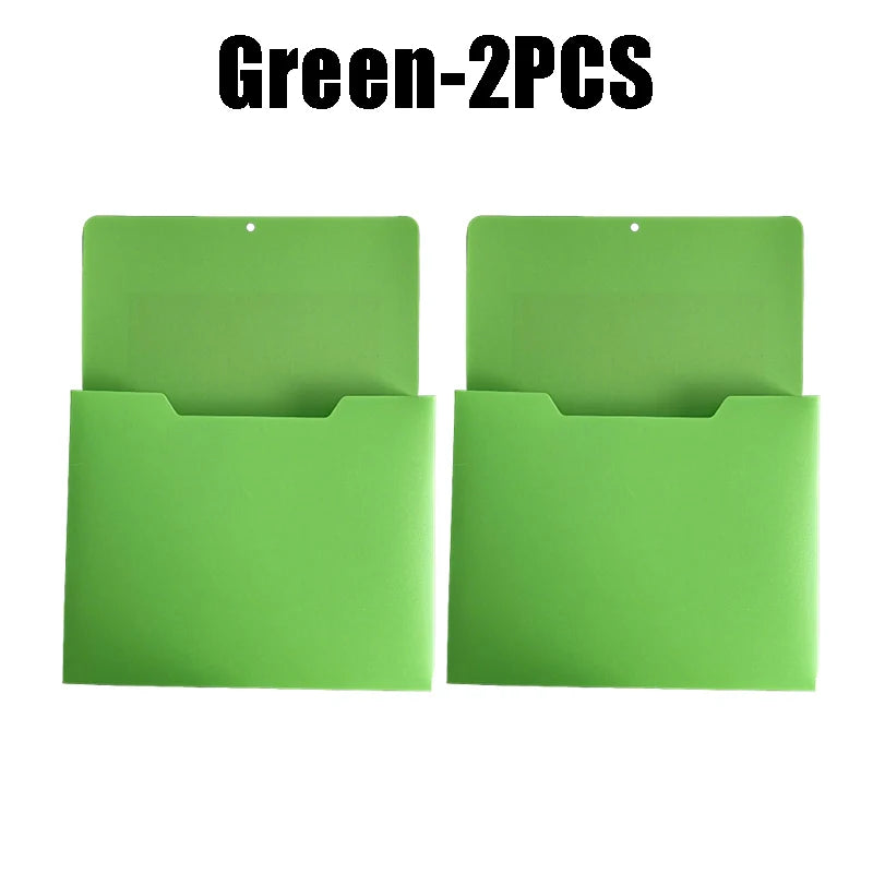 Two green wall mount magnetic document file holders displayed side by side.