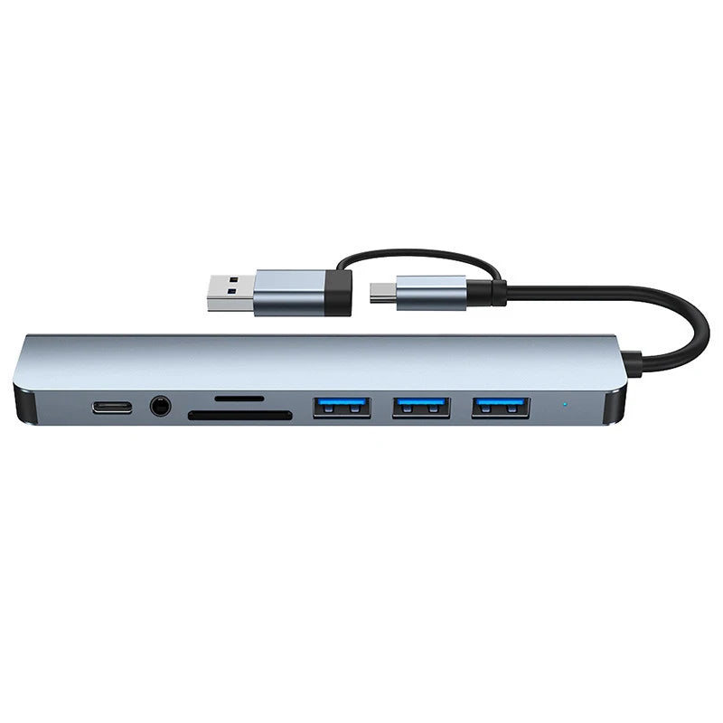 Silver multi-port USB-C hub adapter with audio jack and black cable