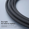Close-up of a black braided nylon charging cable coiled and bent against a light gray background.