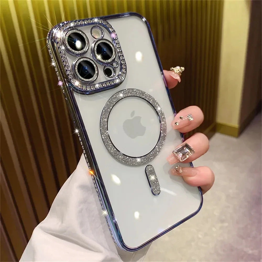 A hand holds a clear phone case decorated with glitter and diamond accents, featuring multiple camera lenses and an Apple log