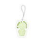 A clear acrylic charm shaped like a sad, pale green face attached to a silver chain.