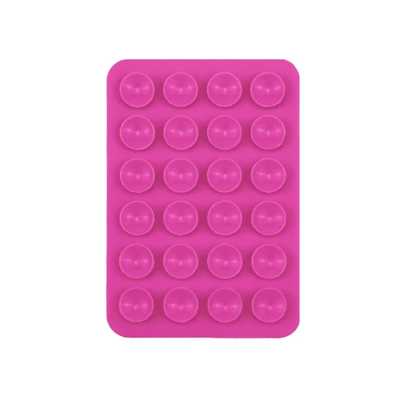 A pink silicone suction cup product featuring 24 round cups for phone and tablet mounts.