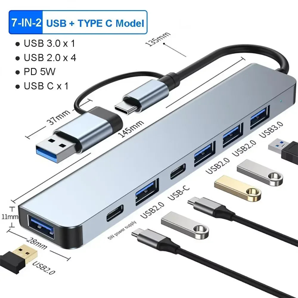 A silver 7-in-1 USB and Type-C hub featuring multiple ports including USB 3.0, USB 2.0, PD 5W, and USB-C connectors.