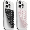 A white smartphone is shown with a silicone suction cup mount featuring a double-sided grip in black and pink.