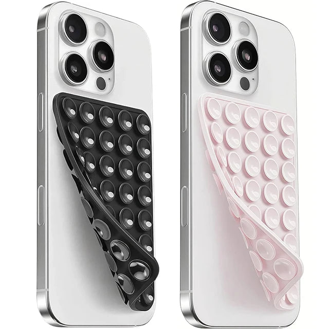 A white smartphone is shown with a silicone suction cup mount featuring a double-sided grip in black and pink.