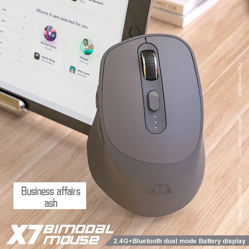 A gray X7 Bimodal mouse is shown next to a laptop displaying an album selection screen.