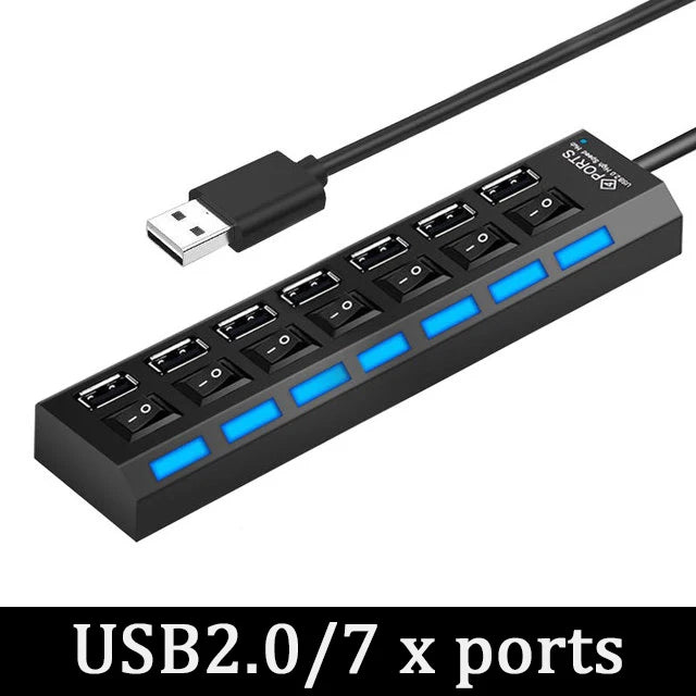 A black USB 2.0/7 x port hub with individual power switches and blue LED indicators connected by a black cable.