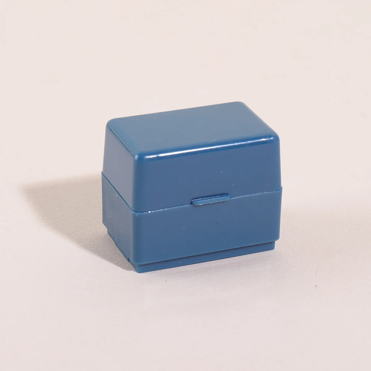A small, rectangular blue roller stamp used for privacy protection on confidential documents.
