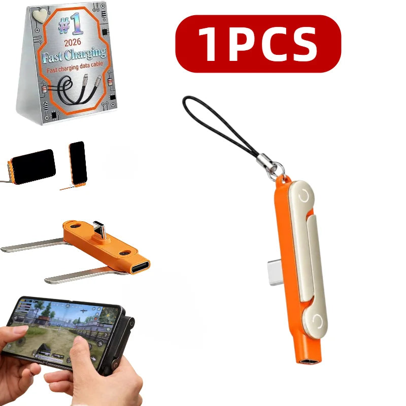 An orange foldable USB-C to USB-C charging adapter and phone stand with a black cable.
