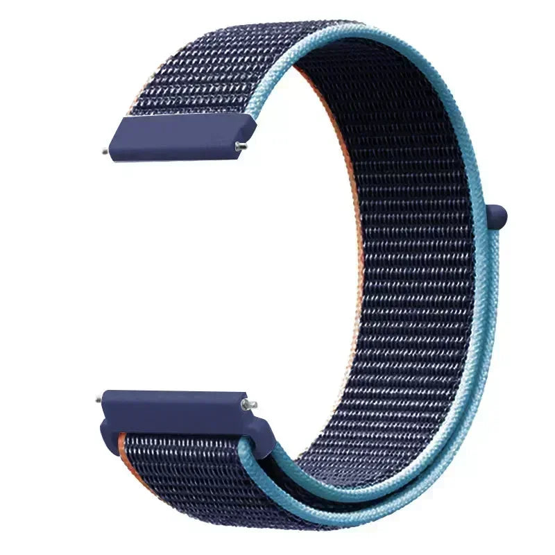 A close-up view of a purple nylon loop watch strap with a textured pattern.