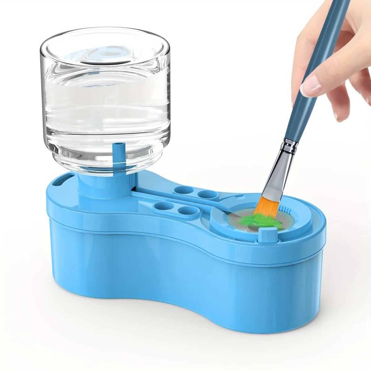 A hand is using a blue paint brush to clean a clear glass jar of paint or liquid inside a blue plastic container.