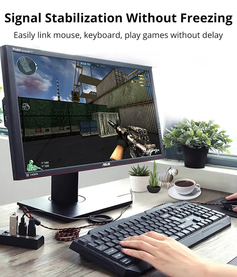 A hand is using a keyboard and mouse in front of a computer monitor, demonstrating signal stabilization technology.