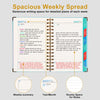 A spiral-bound weekly and monthly planner featuring a deer design with detailed weekly spread pages.