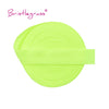 A bright lime green elastic hair tie or trim rolled into a circular shape.