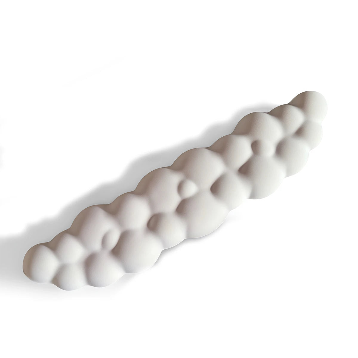 A white ergonomic memory foam wrist rest pad shaped like a segmented finger, shown in profile.