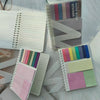 A collection of colorful sticky note notebooks and sheets with various pastel and muted tones.