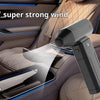 A handheld air blower is shown blowing a strong stream of air onto a car interior surface.