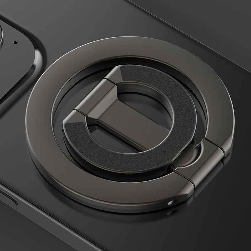 A close-up view of a MagSafe double-sided phone ring holder with a dark gray finish.