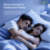 A couple sleeping comfortably in bed, using HTC block snoring earbuds for undisturbed sleep.