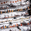 A variety of styles of vintage gothic Halloween masking tape are displayed on a white surface.