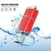 A red metal USB flash drive is shown being protected by water splashes, illustrating multiple protection features.